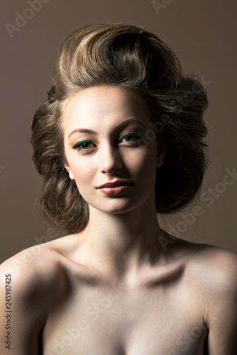 Portrait of shirtless young woman with blond hair