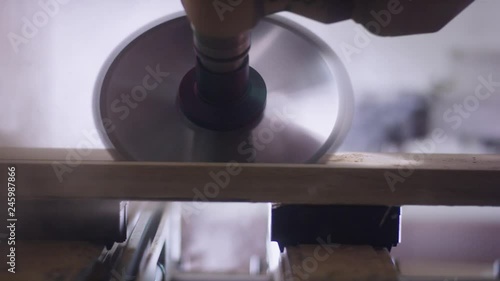 CNC circular saw cuts off a workpiece at an angle - CNC Kreissäge scheidet ein Werkstück schräg ab 4K ProRes Footage photo