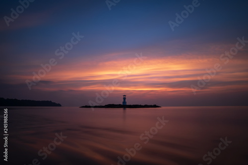 Beautiful Nature Sunset Seascape and Coastline View of Khao Lak Light Beacon Tower at Blue Hour Twilight Sky ,Phang Nga, Thailand