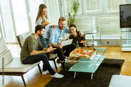 Young people eating pizza, ...