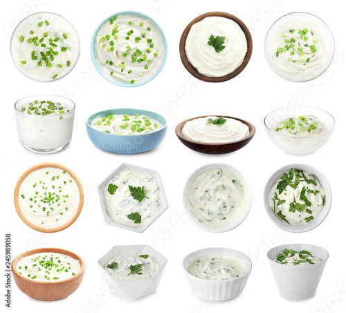 Set of delicious sour cream with herbs in bowls on white background