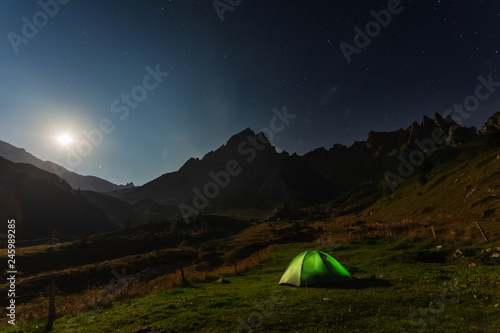 Evening, night and morning camping tents in France with beautiful views of the Alpine Mountains.