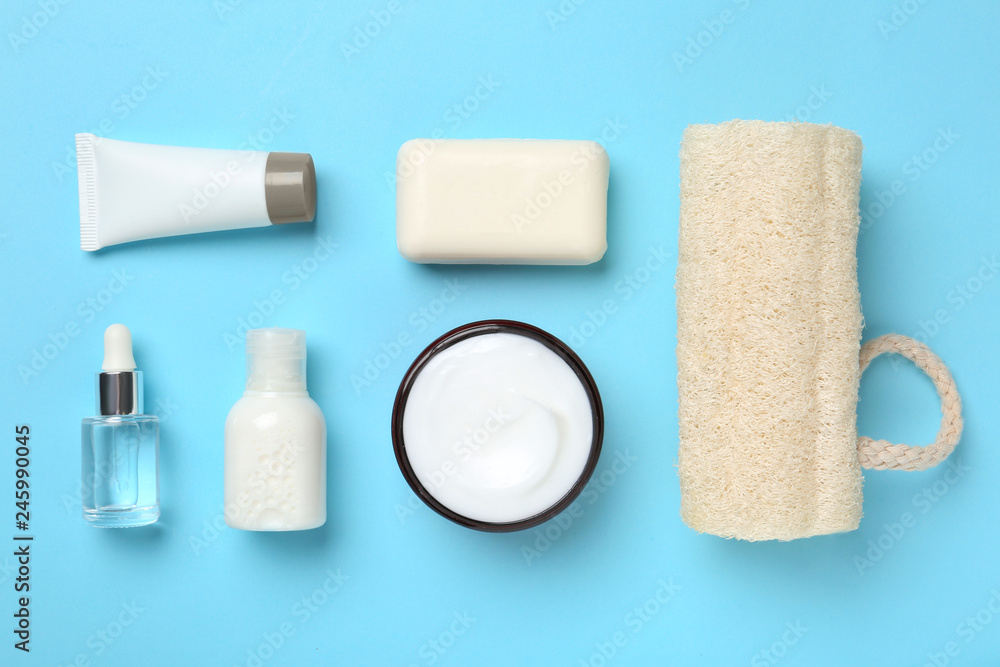 Naklejka premium Flat lay composition with body care products on color background