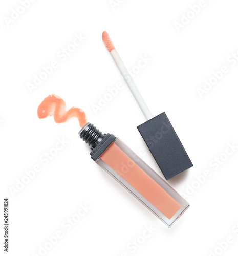 Obraz na plátně Beige liquid lipstick with smear and applicator isolated on white, top view