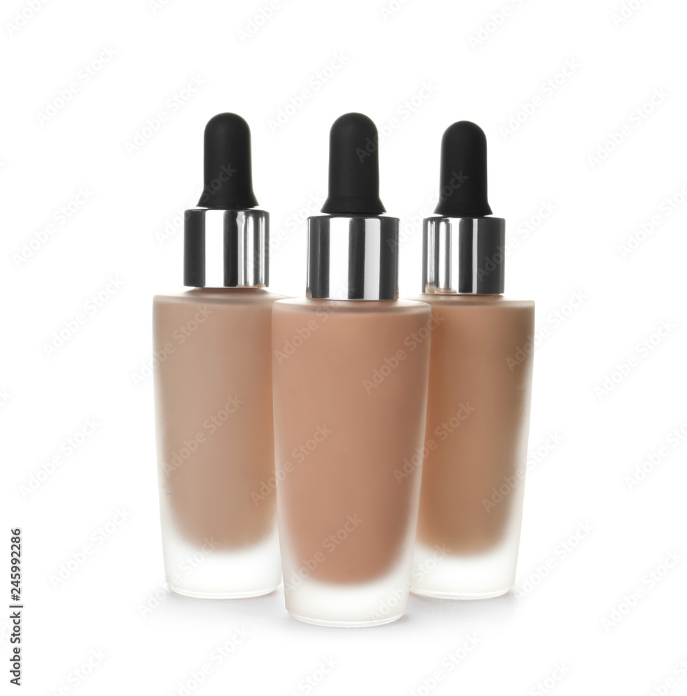 Bottles of different skin foundations on white background Bottles of different skin foundations on white background