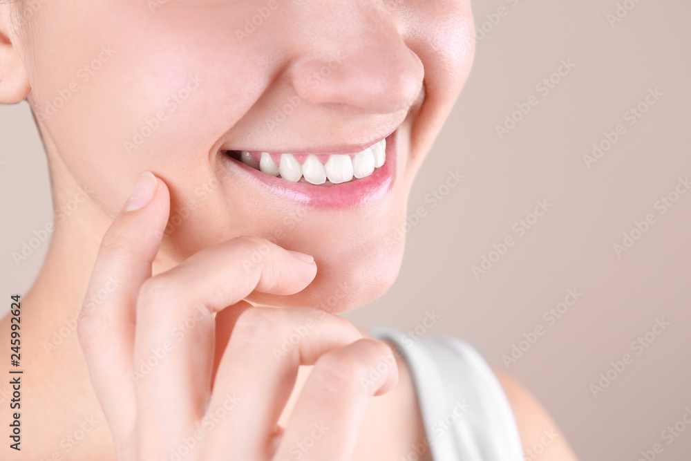 Young woman with beautiful smile on color background, closeup. Space for text Young woman with beautiful smile on color background, closeup. Space for text
