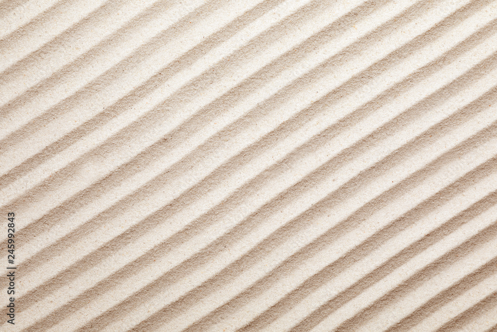 Zen garden pattern on sand as background, top view. Meditation and harmony Zen garden pattern on sand as background, top view. Meditation and harmony