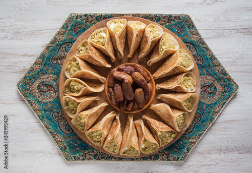 Arab sweets. Arabian pancake stuffed with sweet cheese and pistachios.
