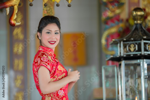 Portrait of beautiful asian woman in Cheongsam dress,Thailand people,Happy Chinese new year concept © reewungjunerr