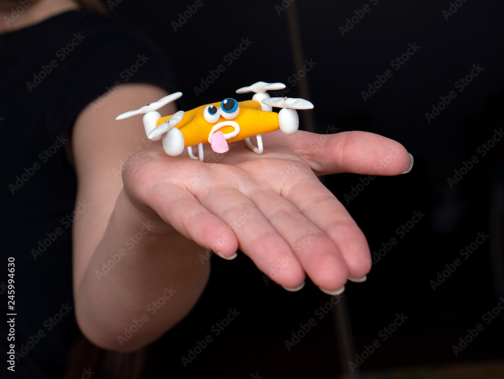 The drone Close up of quadrocopter with the parcel. tired The drone Close up of quadrocopter with the parcel. tired