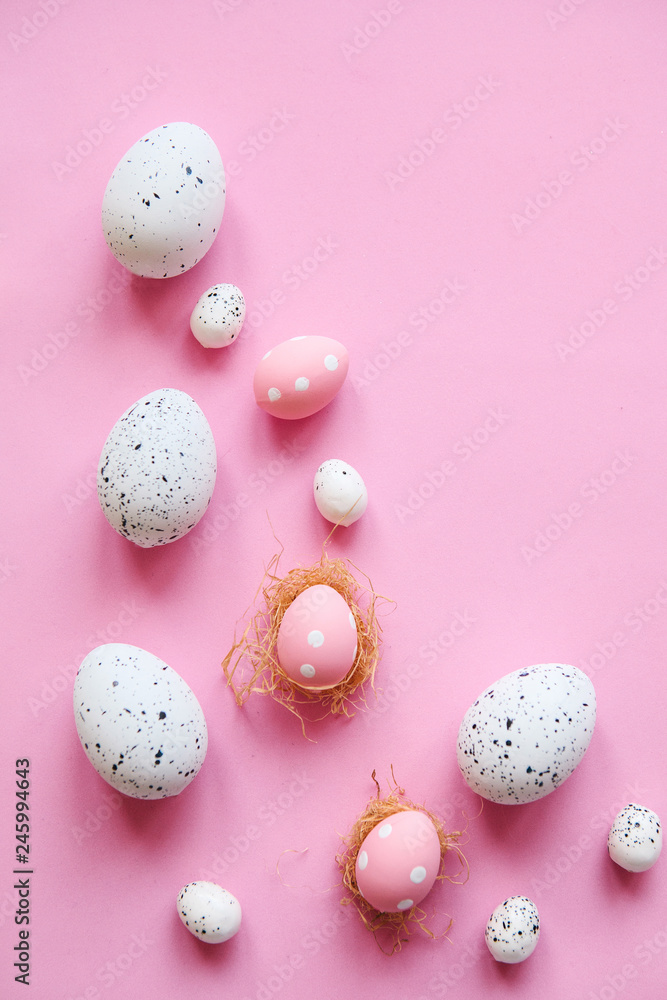 Set of colored eggs on a pink background. Festive Easter concept.