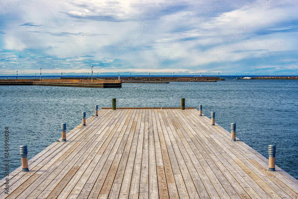 Picture of wooden pier with beatiful blue sky at the background