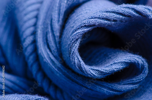Fabric warm blue sweater textile material texture blur background macro