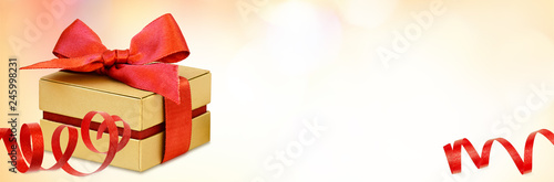 Gift box with red ribbon bo...