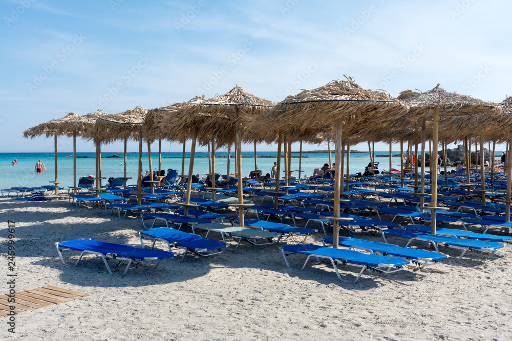 straw sun umbrellas on Elafonisi beach in Crete