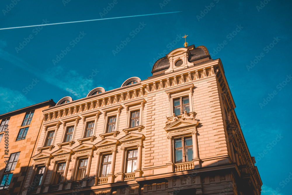 Fototapeta premium Stone facade with architraves of historic building