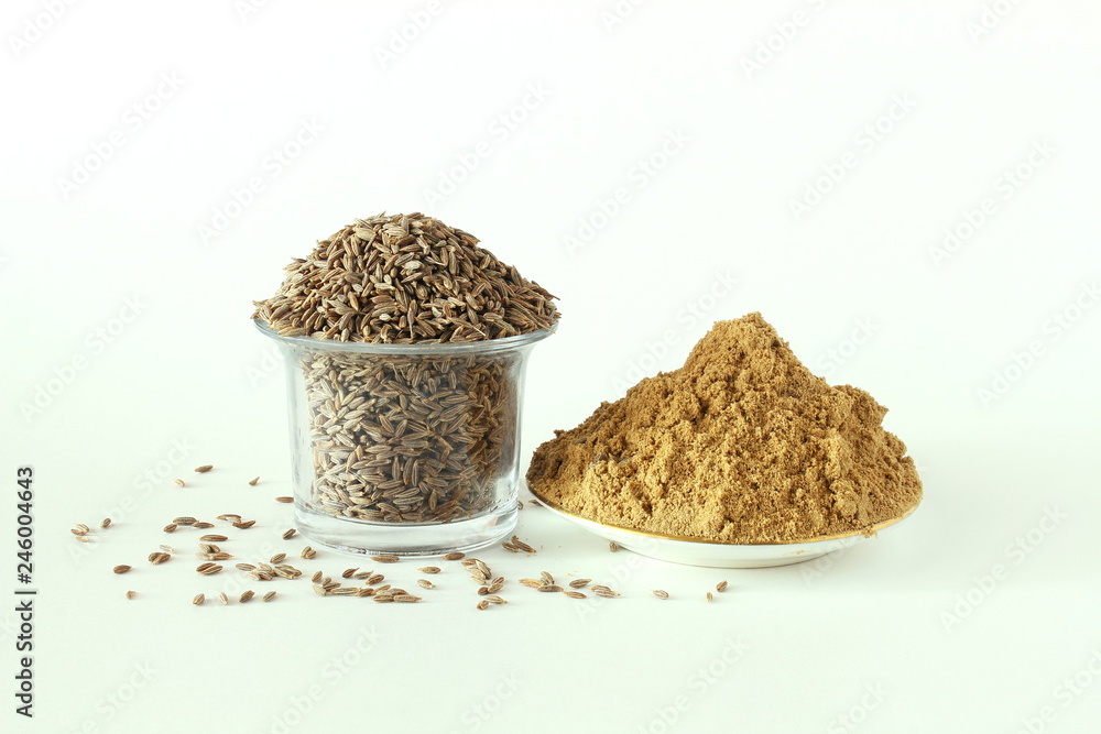 Cumin or caraway seeds whole and powder isolated on white background Cumin or caraway seeds whole and powder isolated on white background