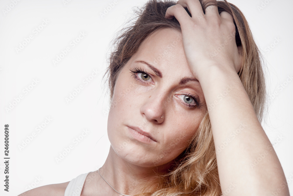 Naklejka premium Psychological portrait of sad and depressed woman. Pain, fear and hopelessness, body language, gesture concept.