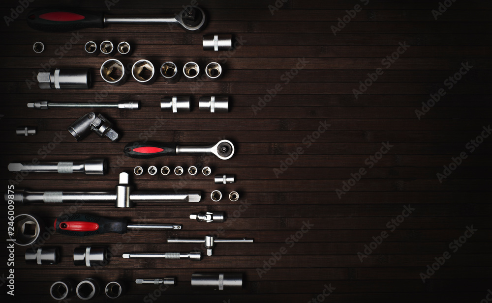 a collection of wrenches for professional maintenance car repair on a dark wooden background a collection of wrenches for professional maintenance car repair on a dark wooden background