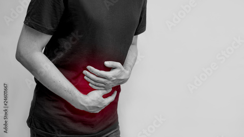 a man holding a belly ache