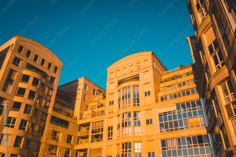 Modern apartment building complex in sunset light