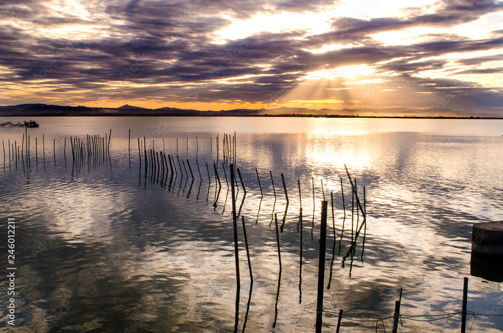 Beautiful sunset on one day cloudy in the famous lake of the albufera of Valencia, Spain. Beautiful sunset on one day cloudy in the famous lake of the albufera of Valencia, Spain.