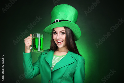 St. Patrick's Day. Beautiful woman wearing green hat with beer