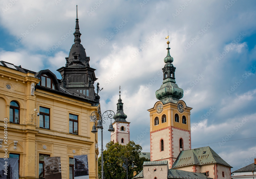 view on city castle and towers on the square in Banska Bystrica, Slovakia