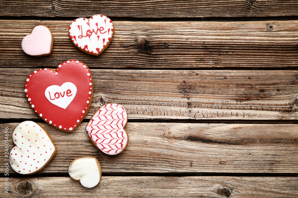 Valentine day heart shaped cookies on brown wooden table