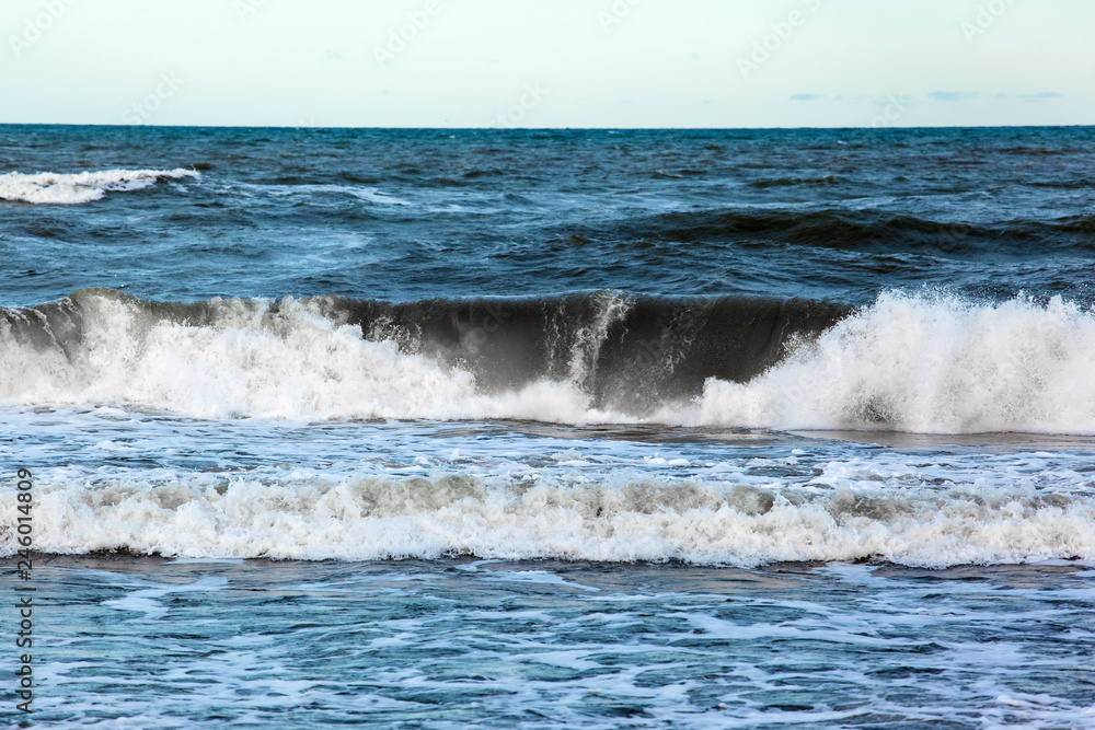 sea surface to the horizon with large waves with foam
