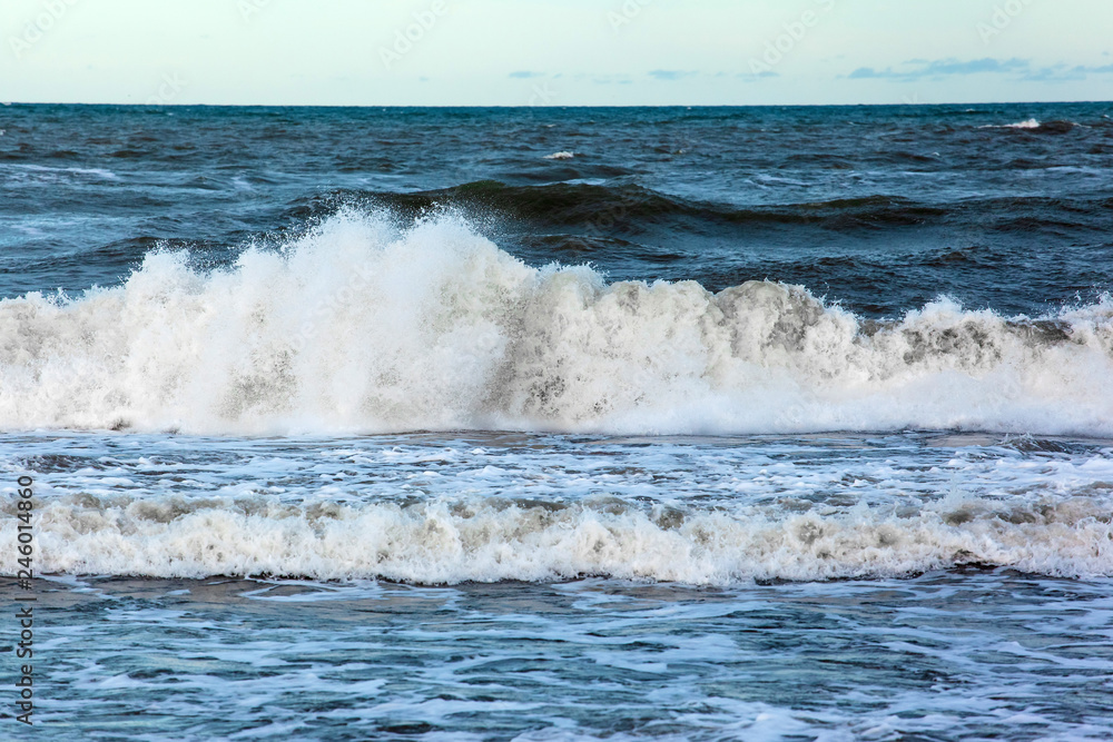 sea surface to horizon with big waves with foam and splashes