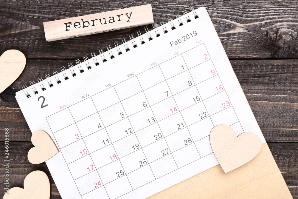 Valentine day calendar with wooden hearts and word February Valentine day calendar with wooden hearts and word February