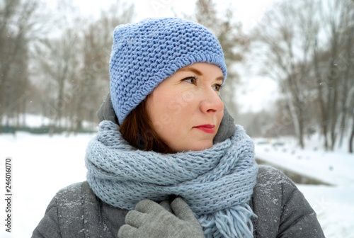 Portrait of adult woman outdoors in winter park