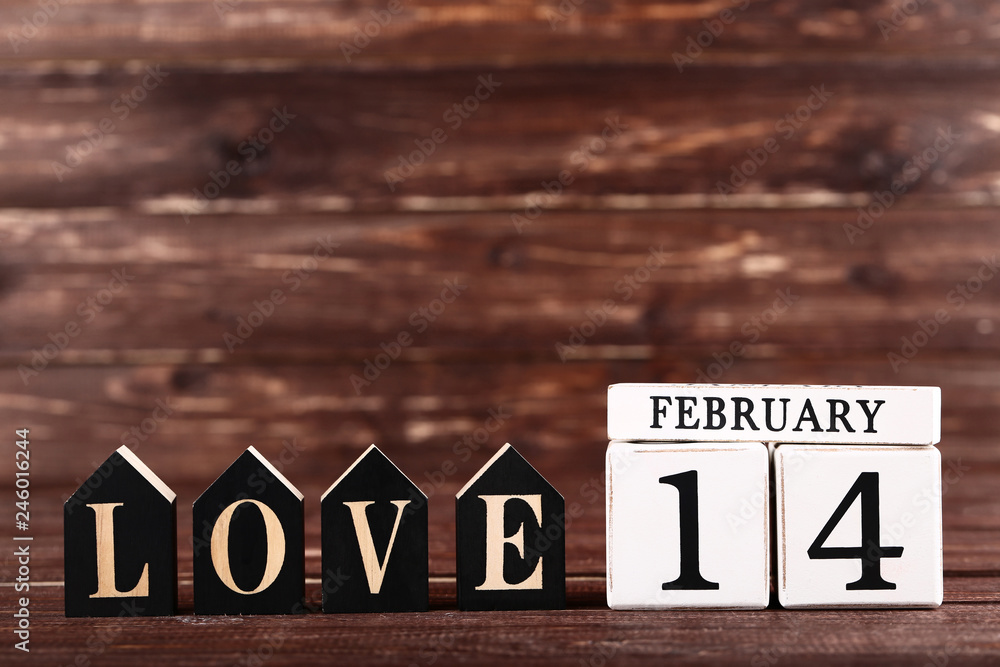 Valentine day on wooden blocks with word Love