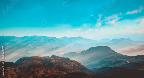 Picturesque landscape of mountain tops in fog