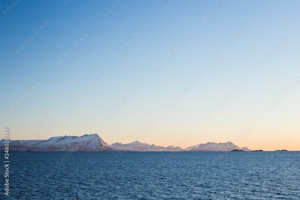 Sunset over the sea during the ferry trip to Lofoten islands (Norway) in winter