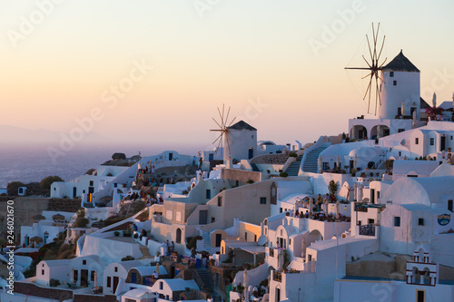 View of Oia Village with windmills at sunset, Santorin, Greece