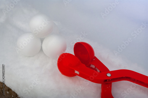 device for sculpting snowball for winter outdoor entertainment. photo