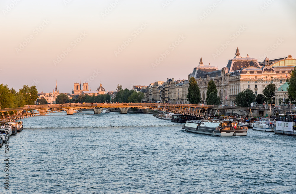 Passerelle Leopold Sedar Senghor and Musee d'Orsay at Golden Hour with Notre Dame in background - Paris, France