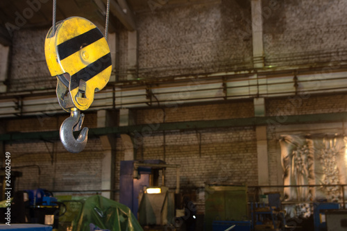 Close up hook crane of overhead crane in factory, machine part concept
