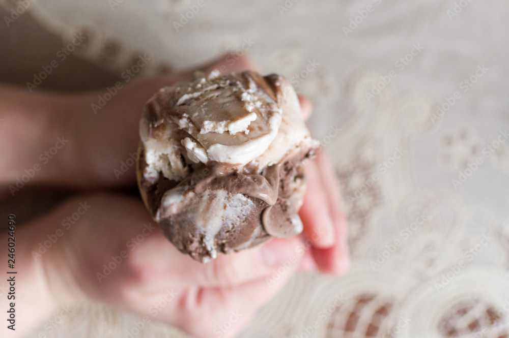 Macro photo of ice cream. Ice cream in the hands of the top view. Macro photo of ice cream. Ice cream in the hands of the top view.