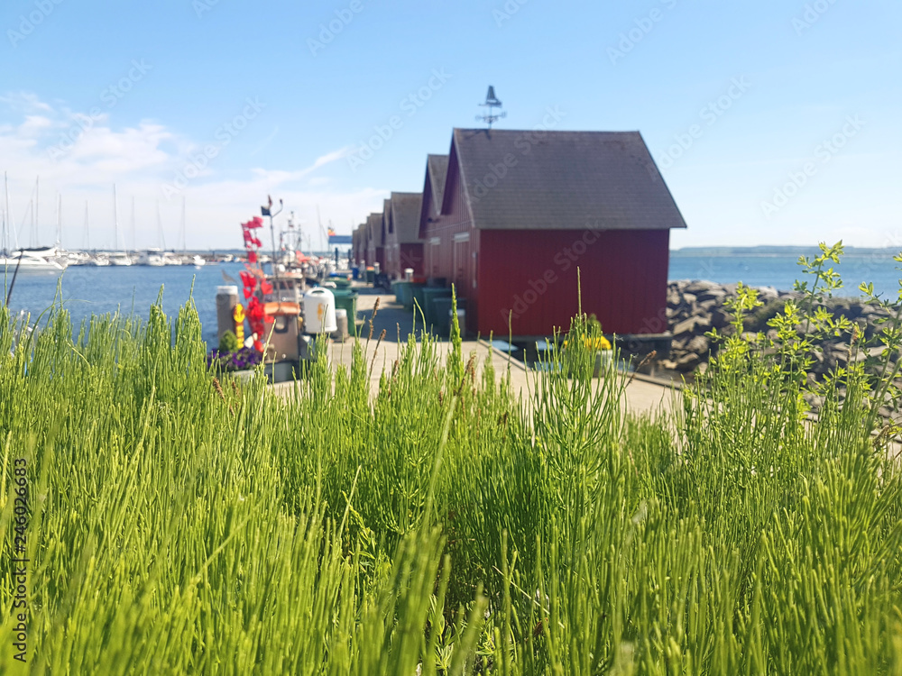 Fishermens wooden red cabins in harbor Fishermens wooden red cabins in harbor