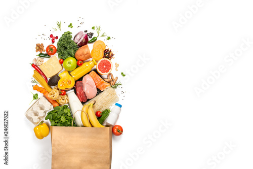 Grocery shopping concept - meat, fish, fruits and vegetables with shopping bag, top view photo