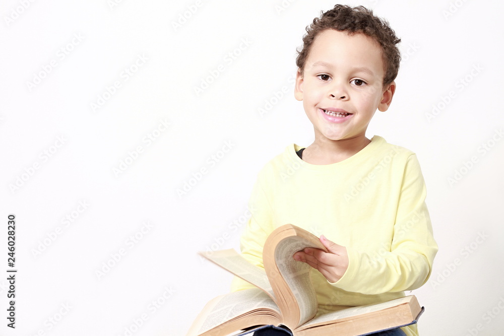 Fotografie little boy with book