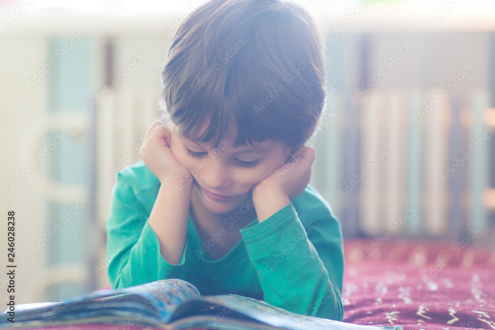 The child is reading a book. The child is reading a book.