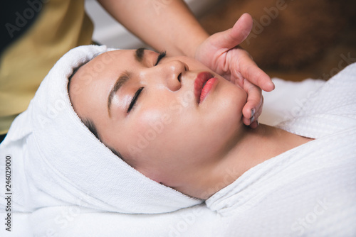 Beautiful young woman getting spa massage salon