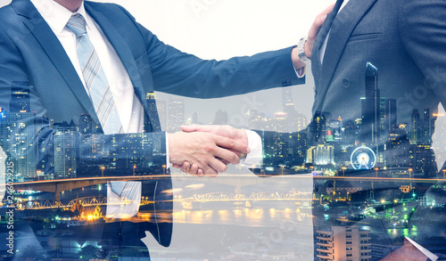 Bilde på lerret Businessmen making handshake business etiquette on white