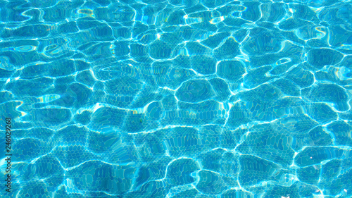 Ripples on the surface of the water in the pool.