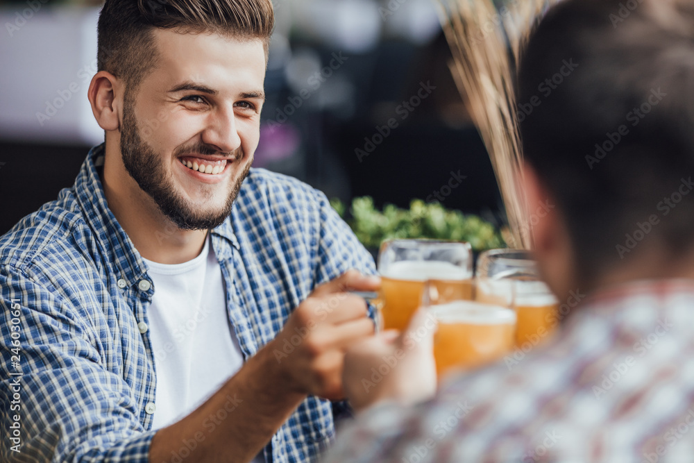 The company have good time with glasses with beers The company have good time with glasses with beers