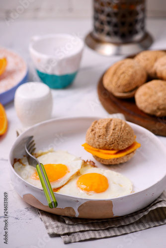 Breakfast  fried Eggs with buns and cheese